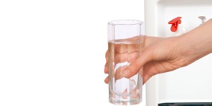 Glass of pure water from an XO BottleLess cooler